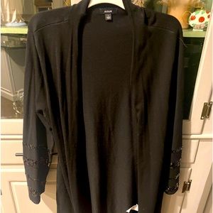 Black sweater with sequin stripped arms.  For dressy occasion!